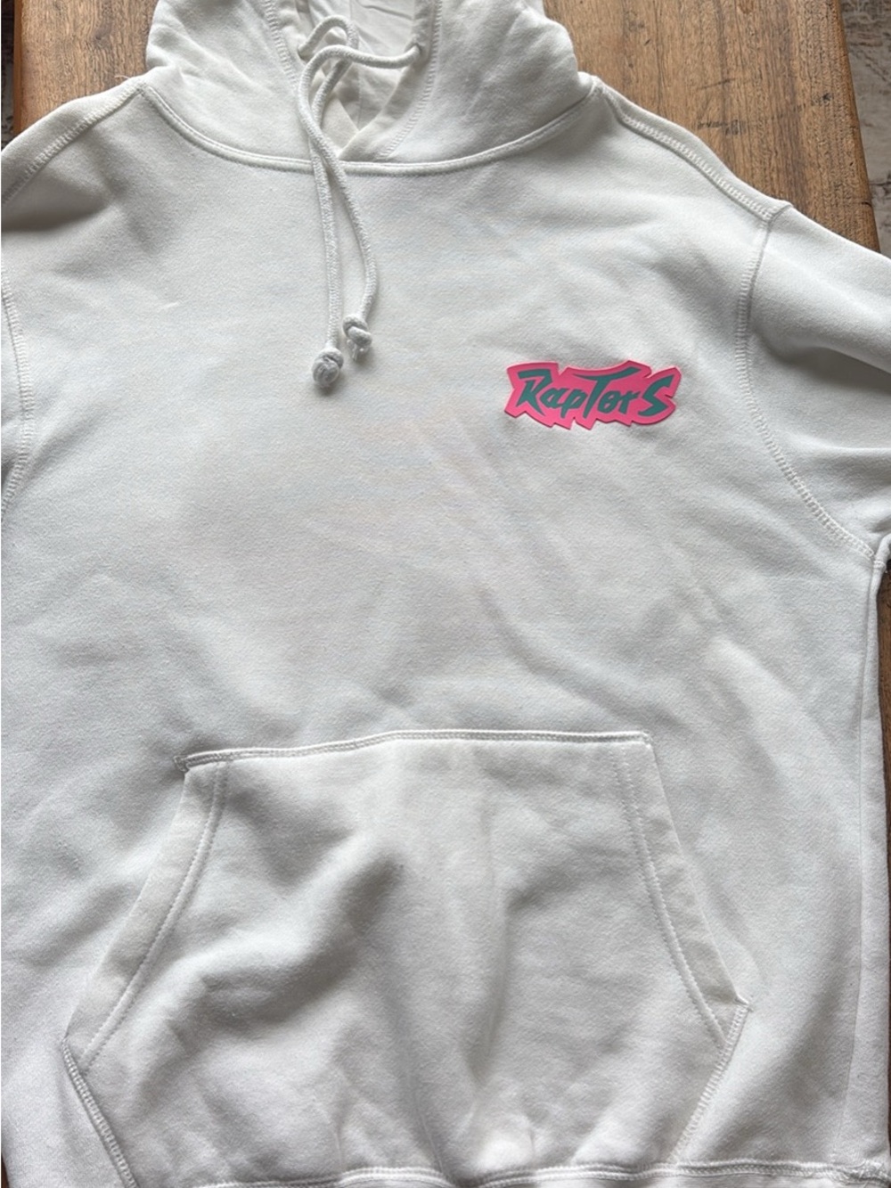 Mitchell & Ness White Hoodie with Pink and Teal Raptors Logo
